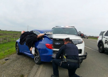 Criminal Hangs Onto Car While Fleeing Police