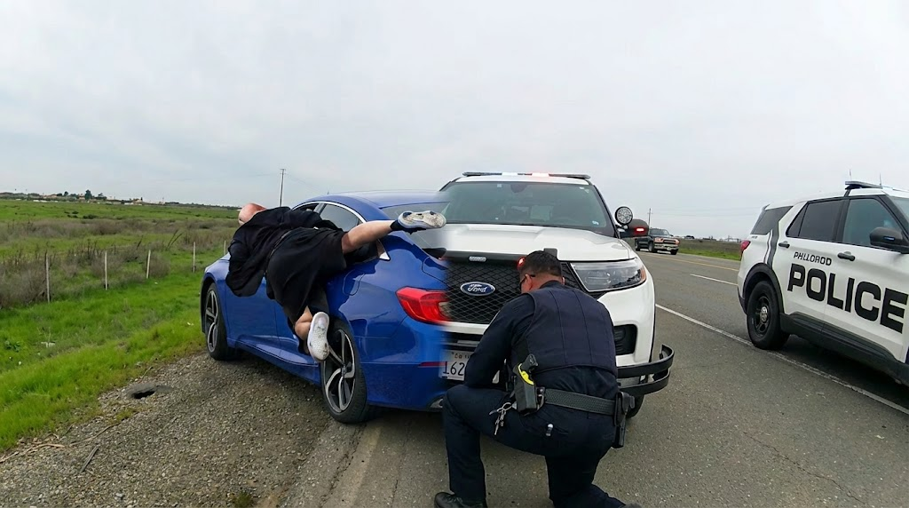 Criminal Hangs Onto Car While Fleeing Police